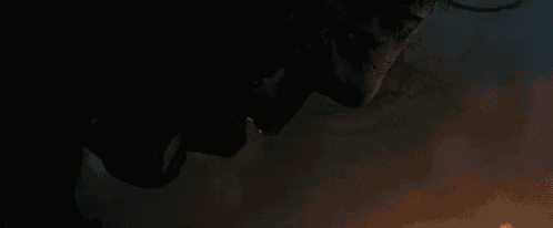 a close up of a person 's face with smoke coming out of it .