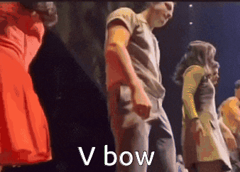 a group of people are dancing on a stage and the word bow is on the bottom of the image