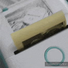 a picture of a man and a woman is being printed on a piece of paper