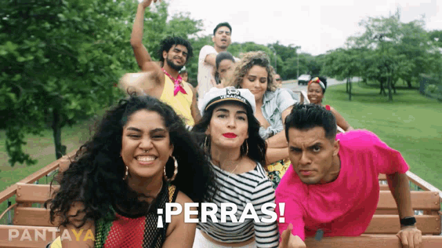 a group of people are posing for a picture and the word perras is visible