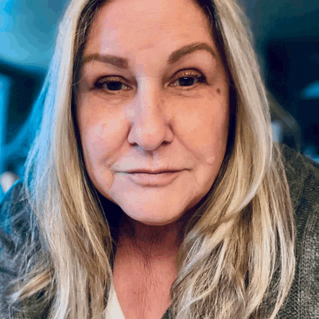a close up of a woman 's face with long hair