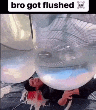 a man is laying inside of a balloon that says bro got flushed on it