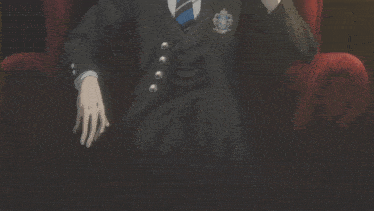 a man in a suit and tie is holding a silver fork in his mouth