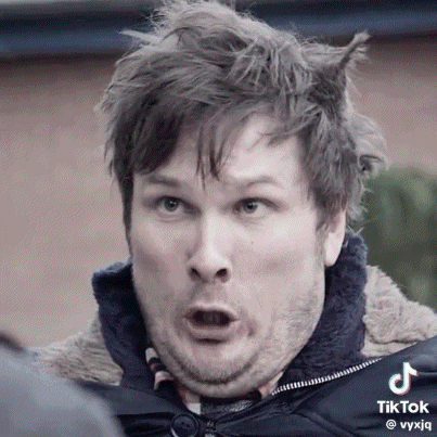 a man is making a funny face with his mouth open