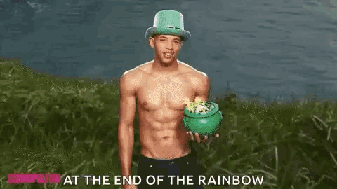 a shirtless man in a leprechaun hat is holding a pot of gold