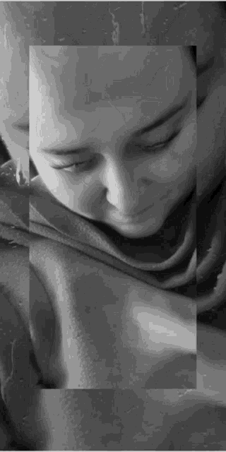 a black and white photo of a person 's face with a square around it