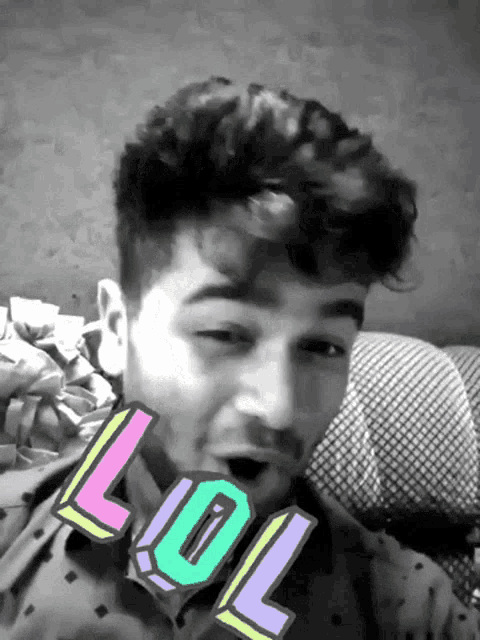 a black and white photo of a man with a lol sticker on his neck