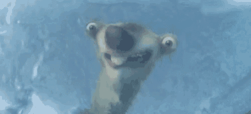 a cartoon character is making a funny face while standing in ice .