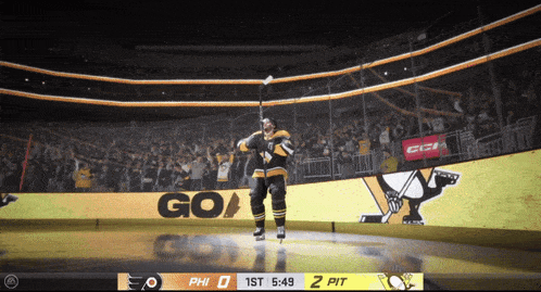 a hockey player stands on the ice in front of a sign that says " go "