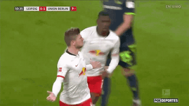 a soccer game between leipzig and union berlin is in progress