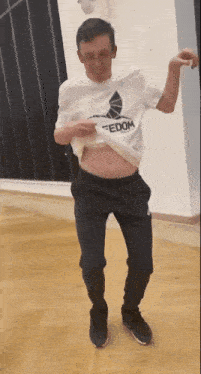 a man wearing a shirt that says tedom on it
