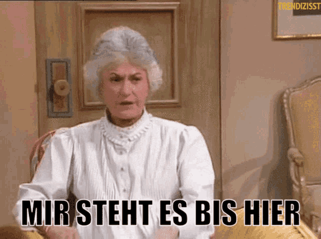 a woman in a white shirt says mir steht es bis hier in german