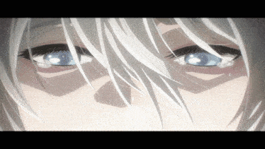 a close up of a woman 's eyes with white hair