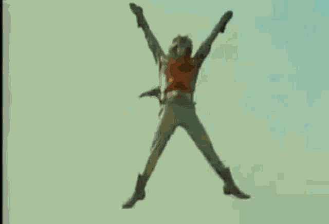 a man is flying through the air with a sign that says x-kick