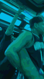a blurry picture of a person sitting on a bus