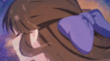 a close up of a girl 's face with her eyes closed and a purple background .