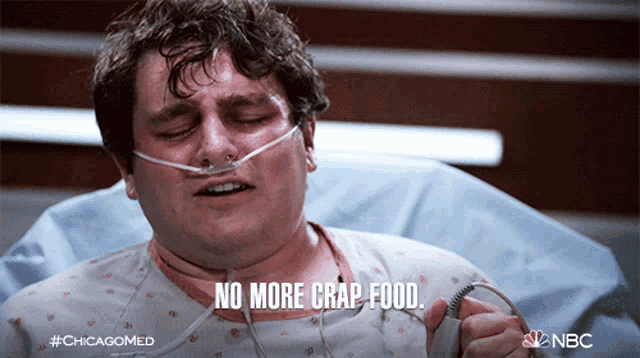 a man in a hospital bed with a nbc logo on the bottom right