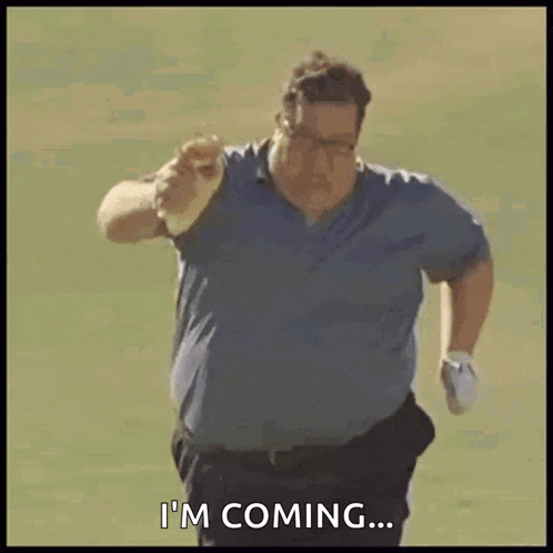 a man is running on a golf course and saying `` i 'm coming ... ''