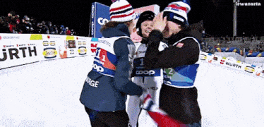 a group of people are hugging each other with one wearing a vest that says norge