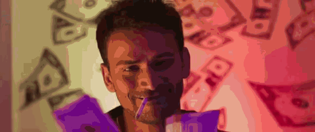 a man is standing in front of a wall with money falling on him