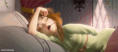 a cartoon character is sleeping on a bed with her mouth open ..