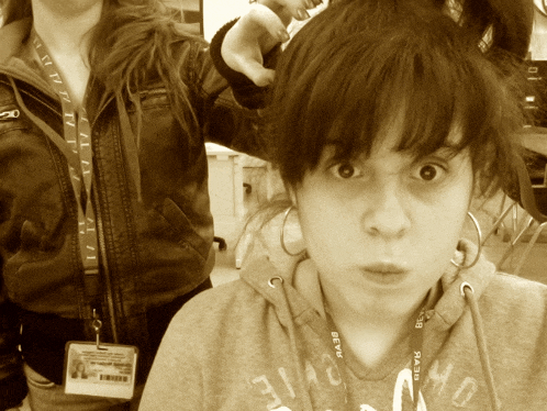 a girl with a lanyard around her neck that says ' bevk ' on it