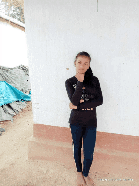 a girl wearing a black shirt that says ' i 'm a girl ' on it