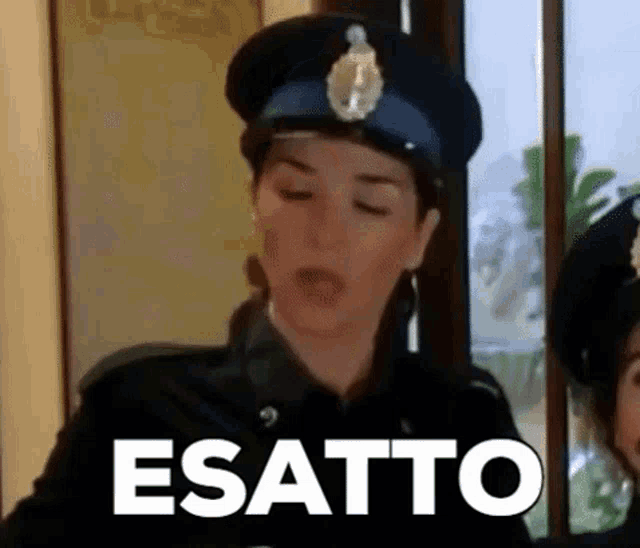 a woman in a police uniform is making a funny face with the word esatto in front of her .