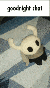 a stuffed animal laying on a bed with the words goodnight chat below it