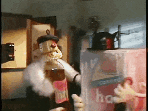 a cartoon character is standing next to a box that says ' iced tea ' on it