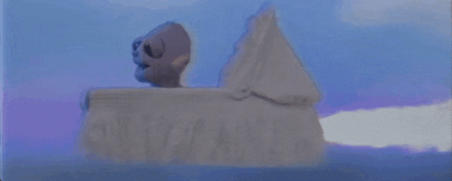 a statue of a skeleton is sitting on top of a pyramid .