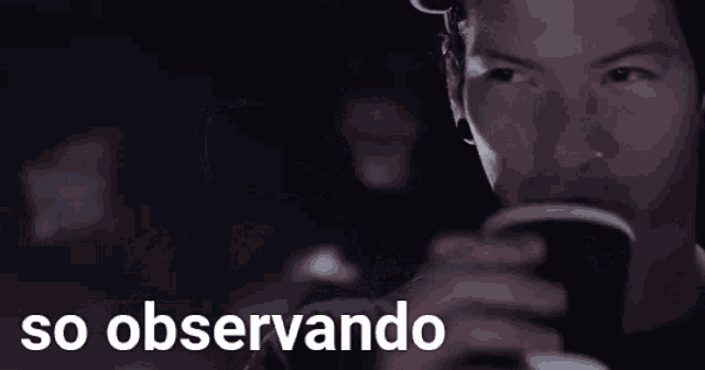 a man drinking a cup of coffee with the words so observando written below him