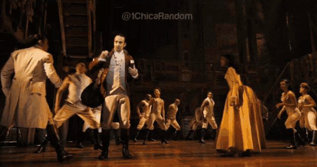 a group of people are dancing on a stage with the words @ 1chica random behind them