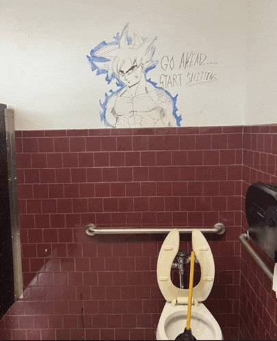 a bathroom with a drawing of goku and the words go ahead start shitting on the wall