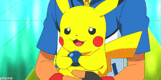 a man is holding a yellow pikachu with a blue ball in its mouth