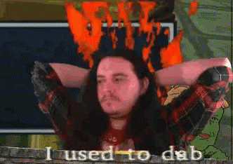 a man with long hair says i used to dab in front of a fire