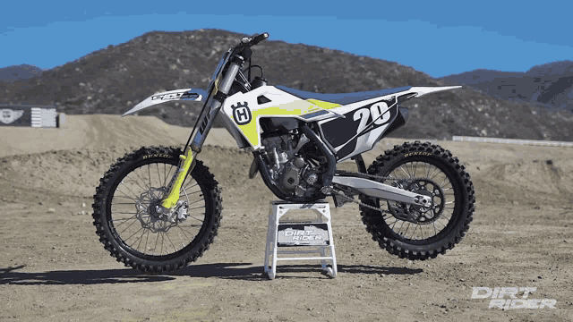 a dirt bike has the number 20 on the front