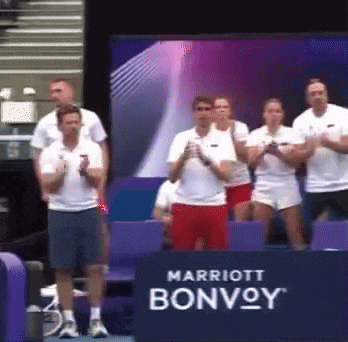 a group of people are standing in front of a sign that says marriott bonvoy