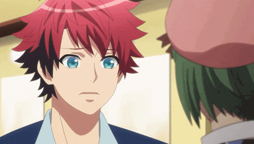 a boy with red hair and blue eyes is looking at another boy with green hair