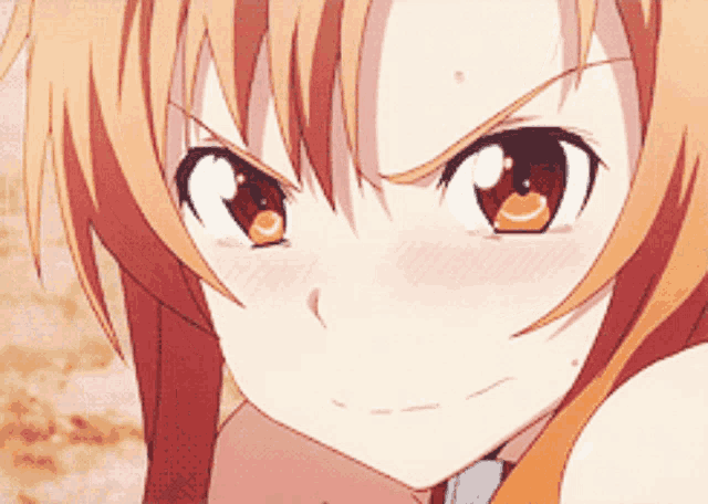 a close up of a girl 's face with a angry look on her face