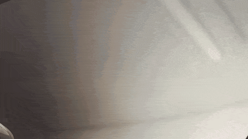 a close up of a white surface with a shadow on it .