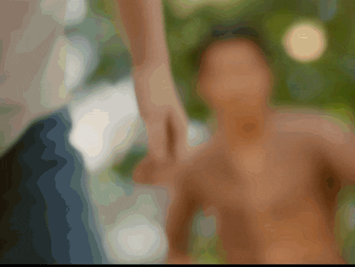 a blurred image of a person holding another person 's hand