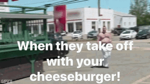 a man running down a street with the words " when they take off with your cheeseburger "