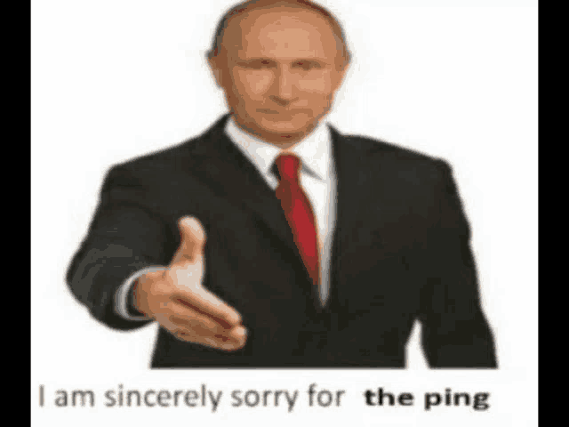 a man in a suit and tie is holding out his hand to shake someone .