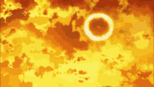 a ring of fire is coming out of the sun in the sky .