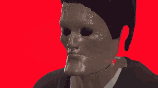 a close up of a man 's face with a mask on it