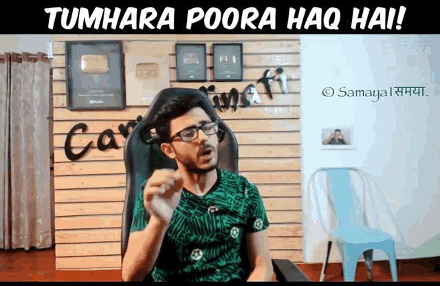 a man sitting in a chair with the words tumhara poora haqq hai written above him