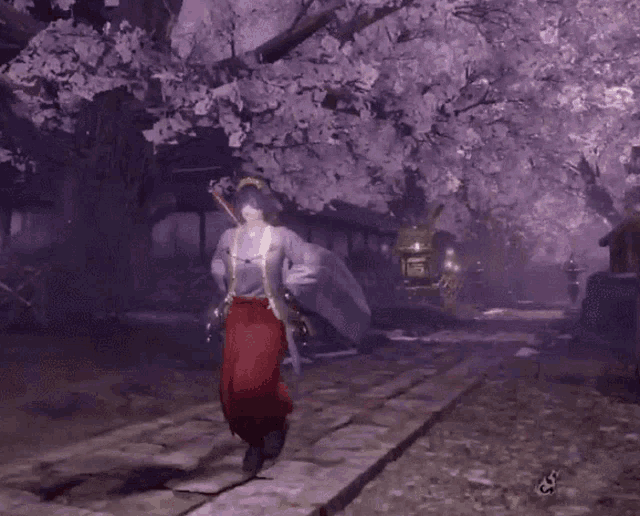 a person in a video game is walking under a tree with flowers on it