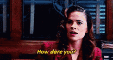 a woman in a red jacket says how dare you .