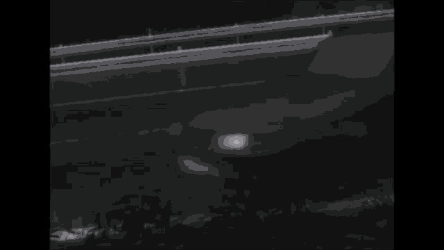 a blurred image of a car driving down a street